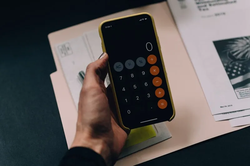Working out debt consolidation repayments with a calculator and statements